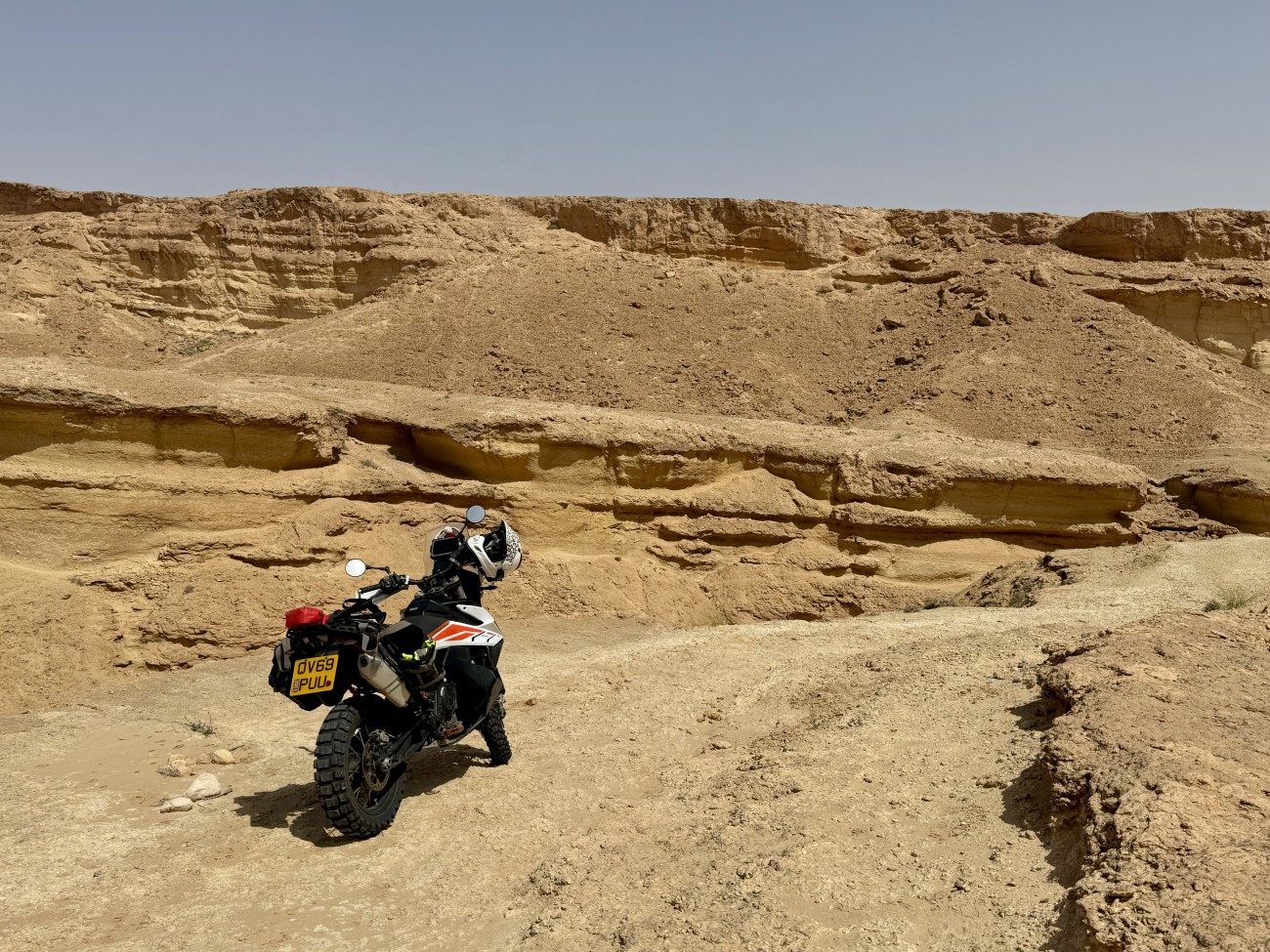 My motorcycle parked in a sandy canyon