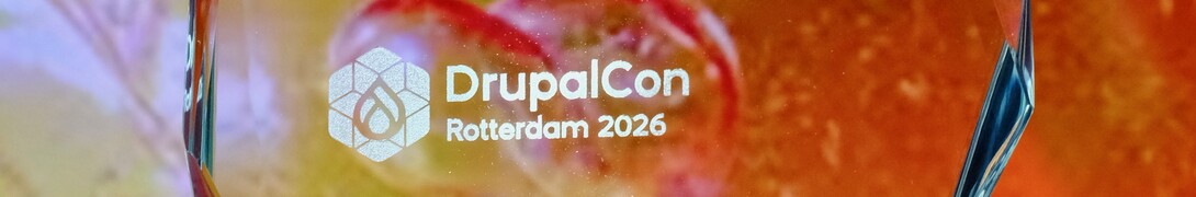 The Women in Drupal award, written out for Rachel Lawson, against the background imagery used in the Driesnote